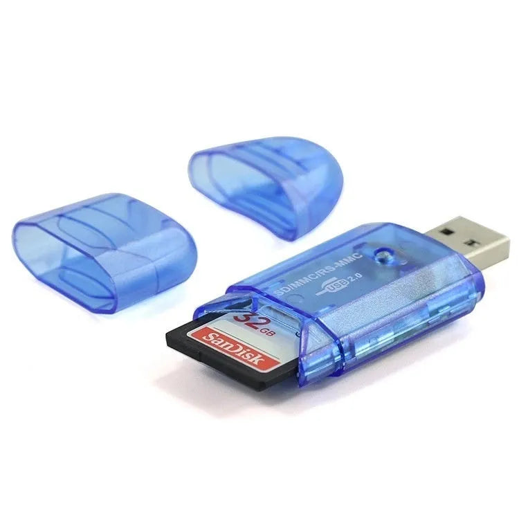 Transparent plastic USB card reader with LED light on a desk.