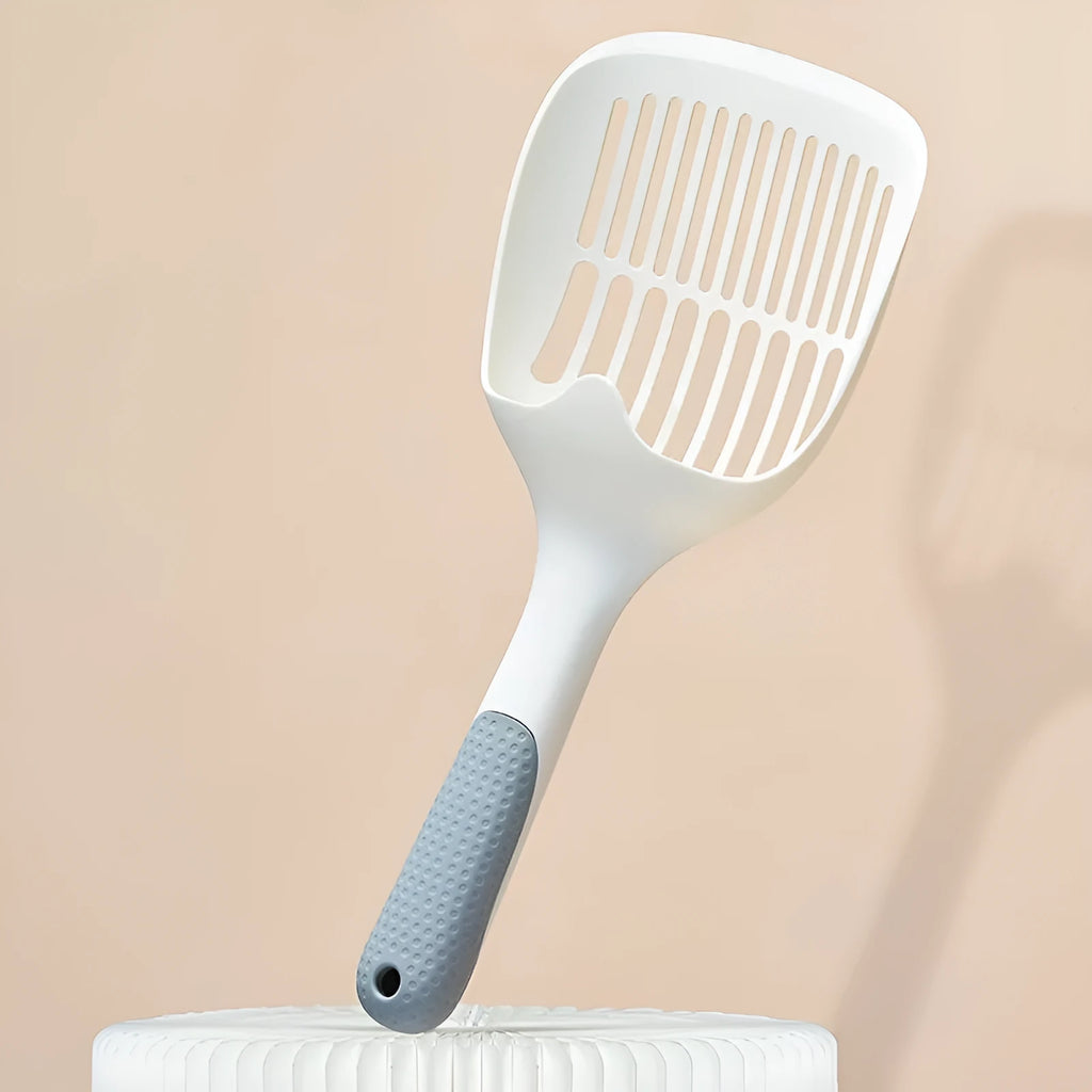 White plastic cat litter scoop with storage base for pet hygiene