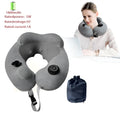 Gray inflatable U shape neck massager pillow with kneading 3 modes, deflated on a table with carry bag and USB cable