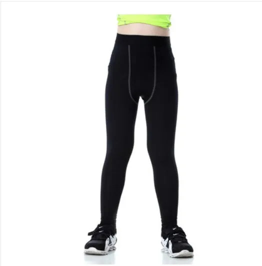 Children's black and green polyester-spandex sportswear set with T-shirt and trousers.