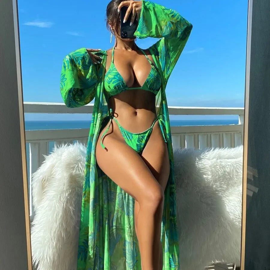 Women's long sleeve bikini swimsuit set with banded briefs and a matching robe in blue.