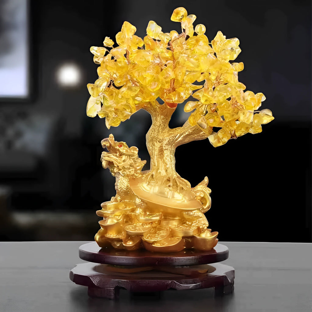 Citrine-coloured resin Feng Shui ornament of a small water turtle money tree on a white background.