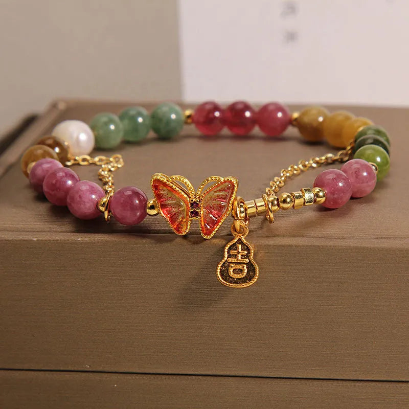 Natural jade coloured tourmaline butterfly agate bracelet for women showing pendant detail