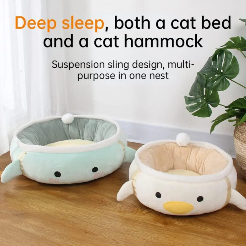 Green dinosaur and chick shaped cat bed shown both flat and hanging as a hammock.
