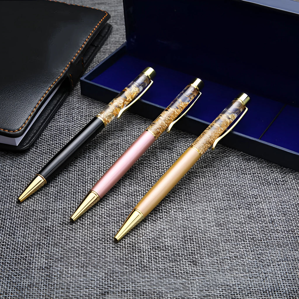 Gold foil metal ballpoint pen 13.8cm with 1mm tip on white background