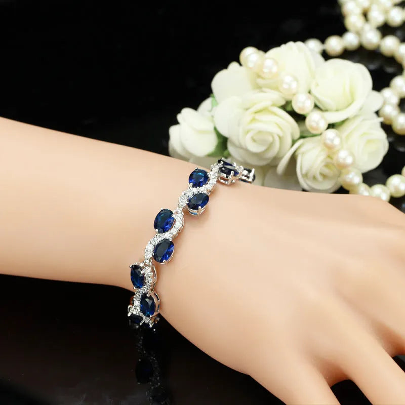 Copper-plated gold bracelet with AAA zircon stones on a wrist, showing geometry design.