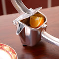 Silver heavy duty aluminium alloy lemon squeezer with extra large bowl on kitchen counter