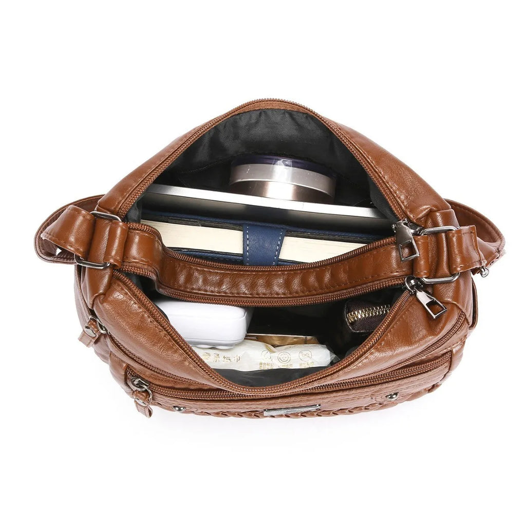Soft PU leather shoulder bag in wine red with wash finish and outer pocket, 26x19x8cm