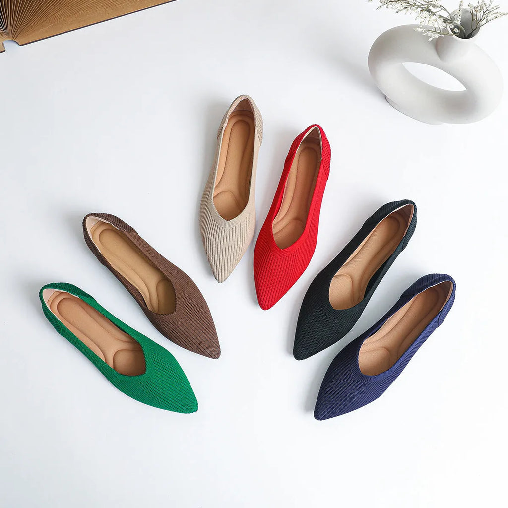 Women's apricot-coloured knit flat pumps with a pointed toe and slip-on design on a white background.