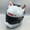 Set of black and white wolf ear and tail ornaments clipped to a motorcycle helmet