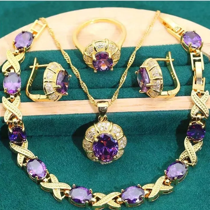 18k gold-plated necklace, earrings, ring, and bracelet set with colourful Raytheon-cut cubic zirconia stones.