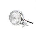 Black retro car headlight with aluminium housing and choice of coloured glass lenses.