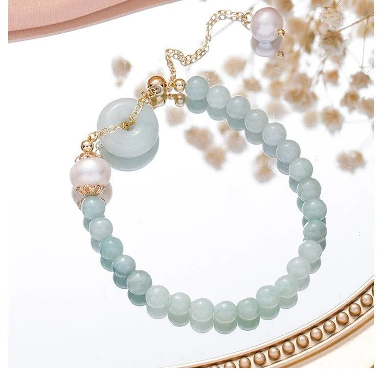 Women's Korean style crystal bracelet with choice of jade pendant, strawberry quartz, or spodumene purple styles and various buckle types.