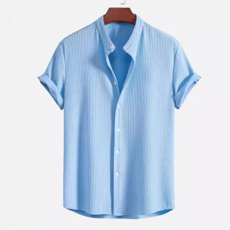 Men's loose-fitting short sleeve shirt in light blue polyester fabric on a hanger.