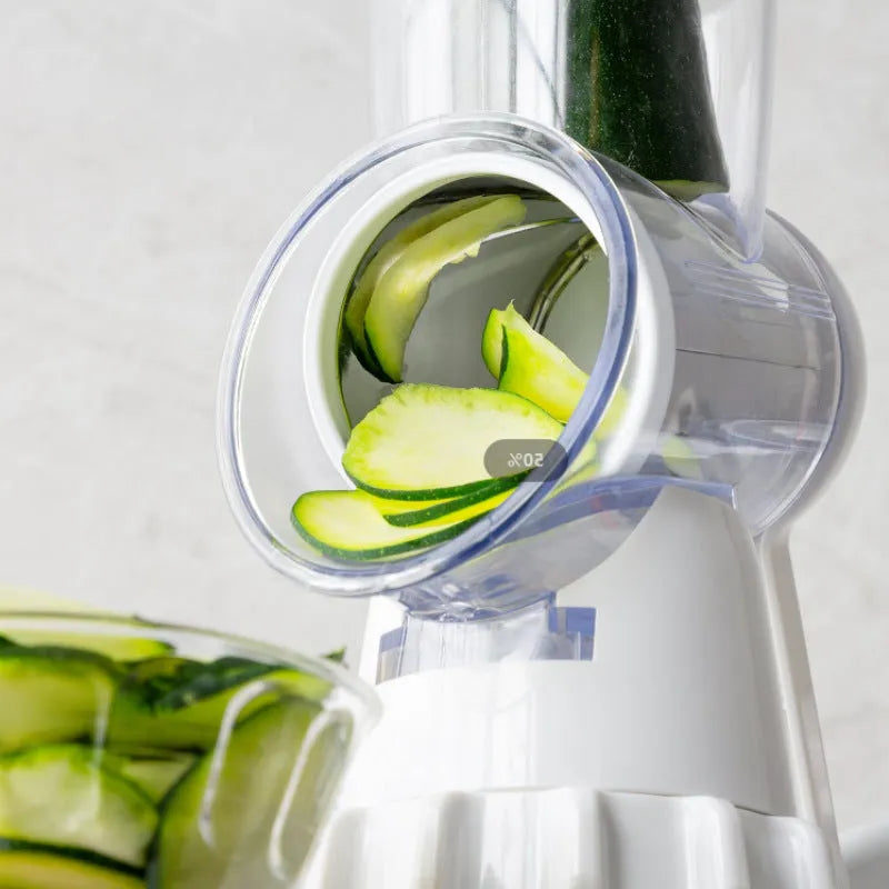 White plastic 3-in-1 manual vegetable slicer with suction feet and stainless steel blades