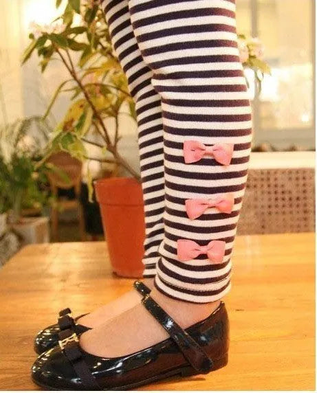 Pink cotton girls' clothing sets displayed in sizes 110cm, 120cm, 130cm and 140cm