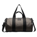 Black waterproof Oxford cloth sports handbag for men and women on a leisure travel background.
