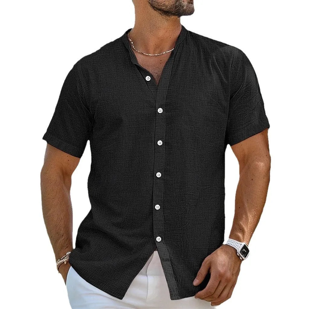 Men's loose fit light blue cardigan shirt with a Henry collar and short sleeves, made from cotton and linen.