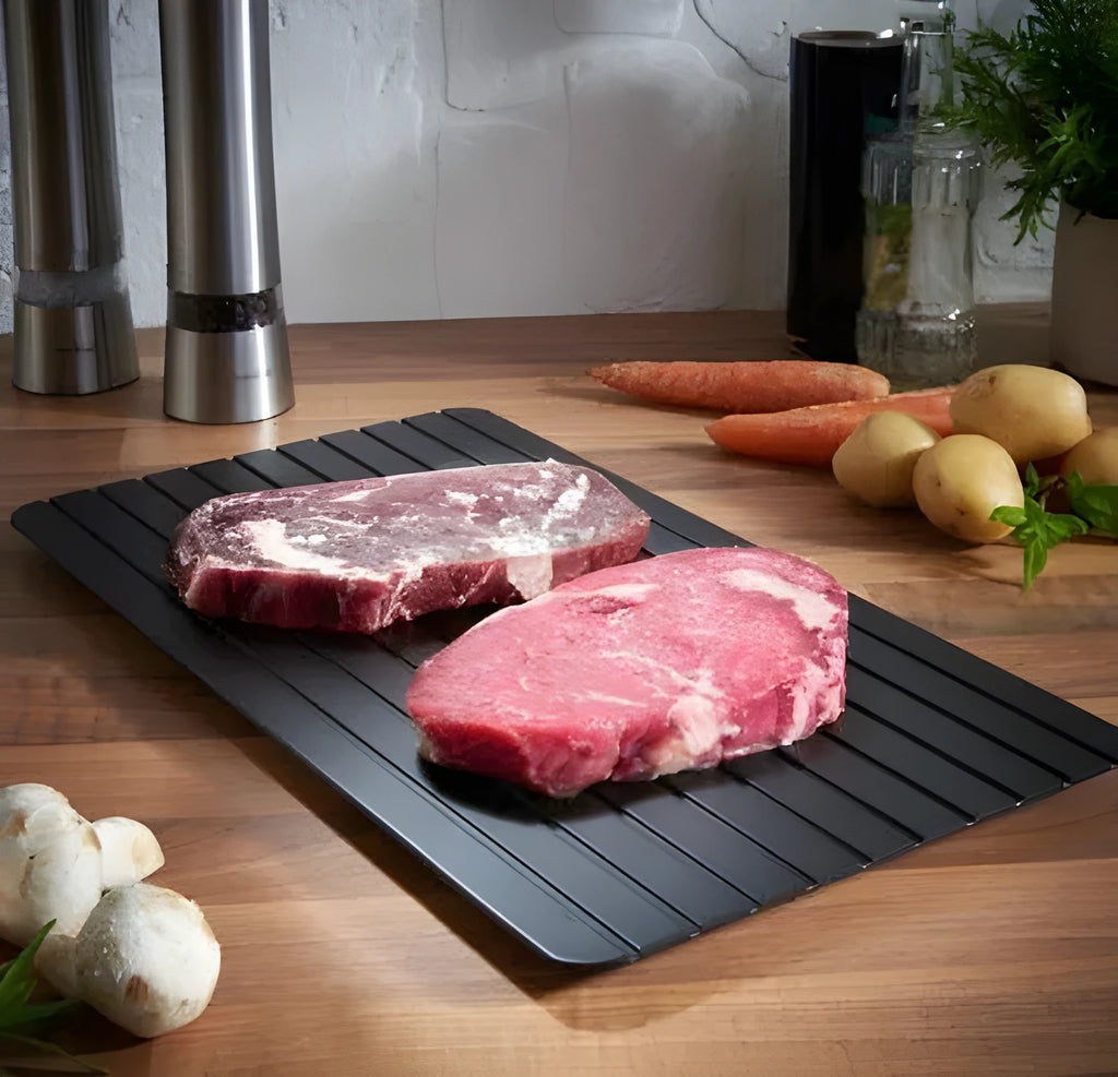Black aluminium kitchen defrosting tray for thawing frozen meat and food without electricity