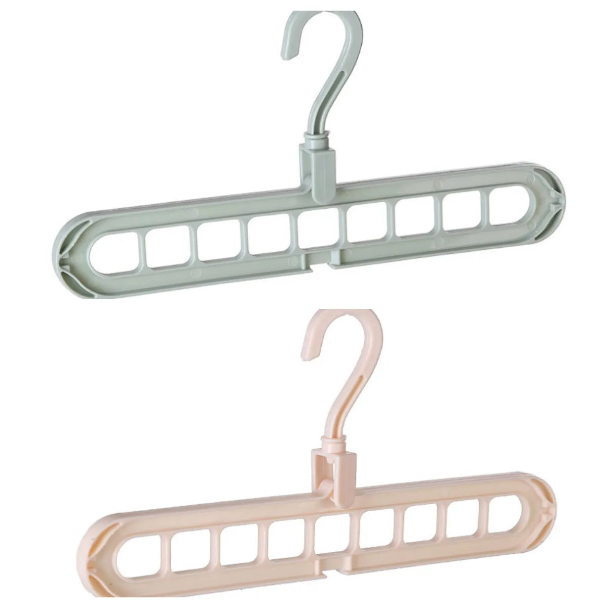 Plastic clothes hanger with rotating hook in pink colour, shown next to a green hanger.
