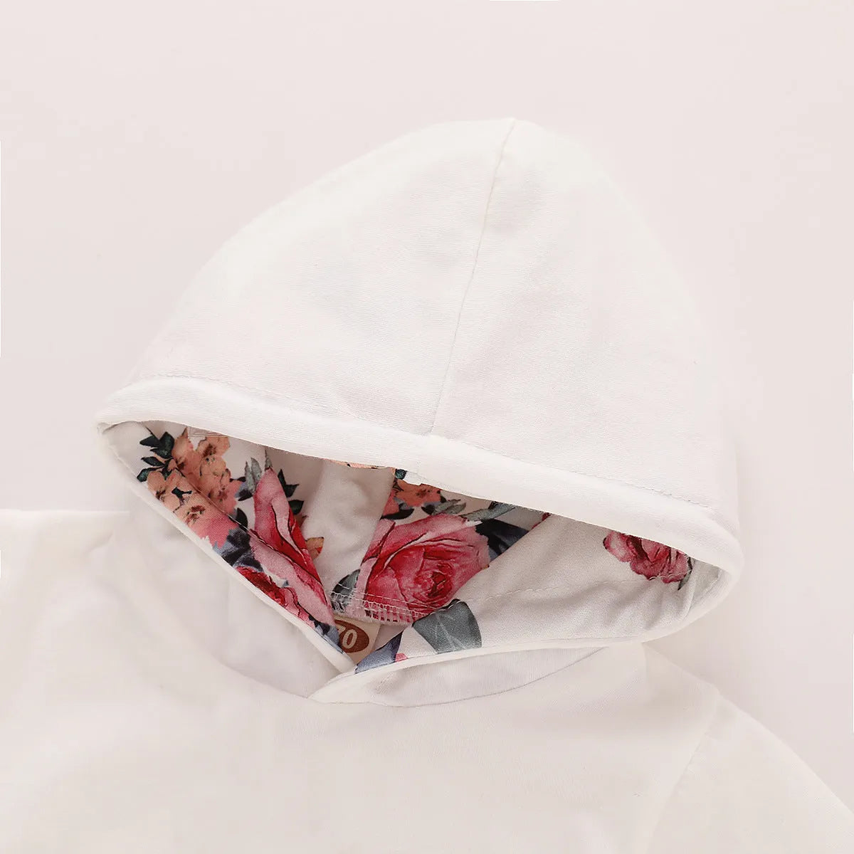 White cotton hooded tracksuit set for infant girl with long sleeves and trousers.