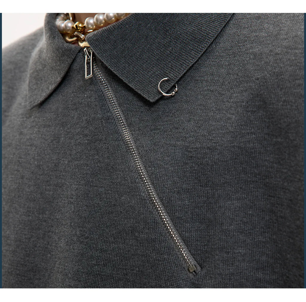 Man wearing a slim-fit grey knitted polo shirt with a diagonal oblique zipper and lapel collar.