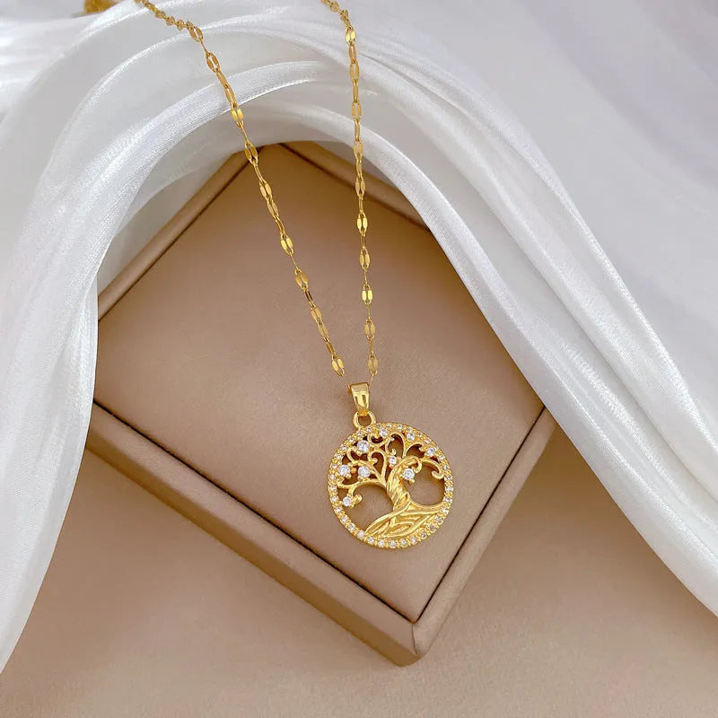 Gold-coloured adjustable necklace with an iridescent mother-of-pearl cross pendant on a detailed lip chain.