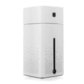 Black and white compact desktop humidifier with USB cable and 1000ml water tank.