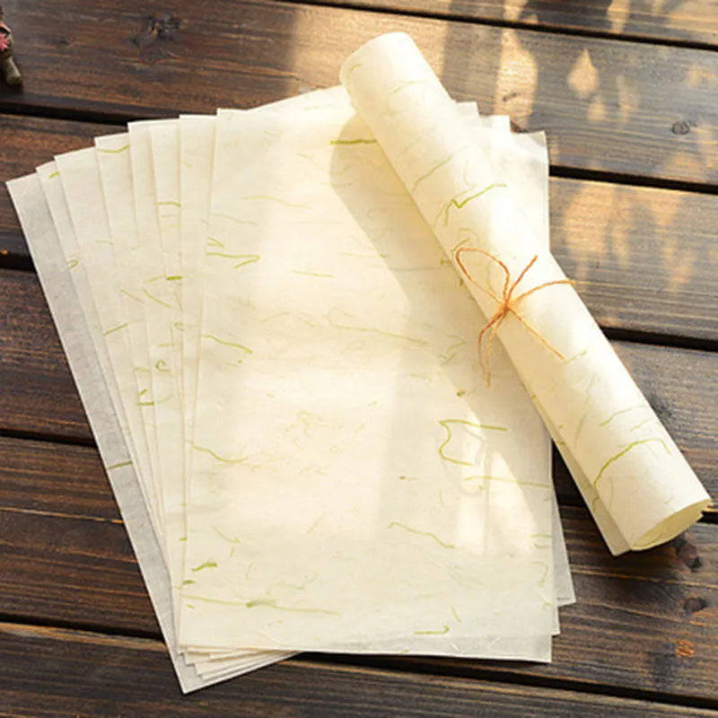 Ten sheets of Chinese-style painting paper in Green leaf design, each measuring 27.5 by 16.7 cm.