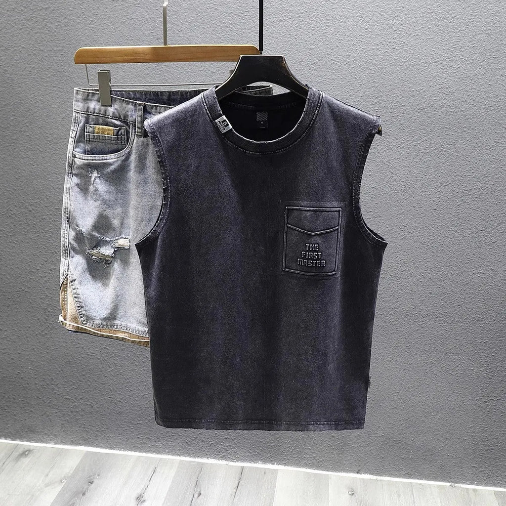 Men's solid black cotton sleeveless t-shirt with loose fit and straight hem on a white background.
