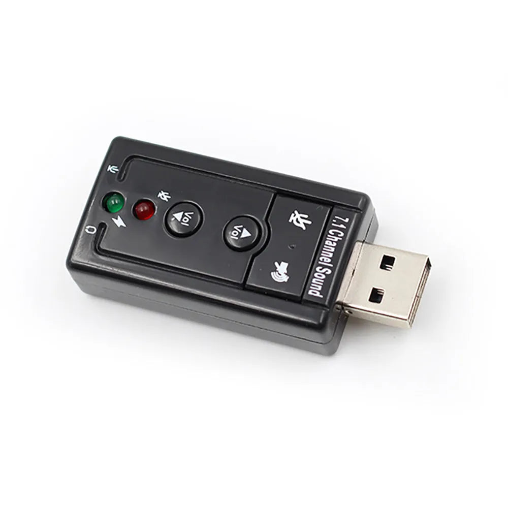 Black external USB sound card with 3.5mm headphone and mic jacks connected to a laptop