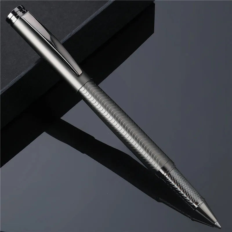 Fog gun grey metal signature pen with bullet nib and 0.5mm line width on dark table