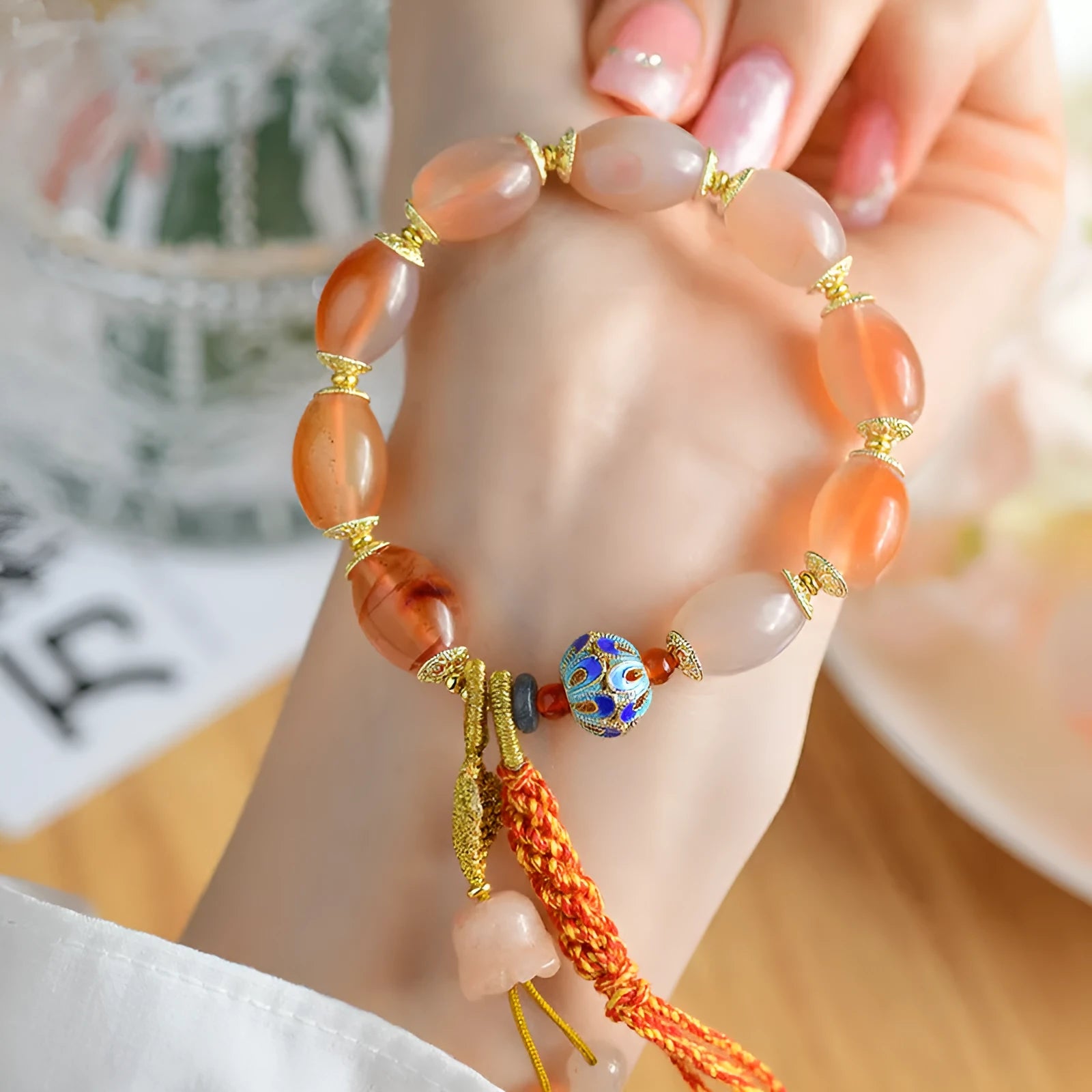 Vintage Tibetan agate bracelet with floral and geometric patterns including lily motif