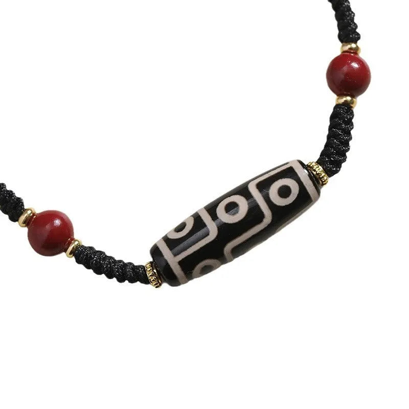 Men's Tibetan agate Dzi bead bracelet with shrinkable adjustable closure showing traditional couple style beadwork