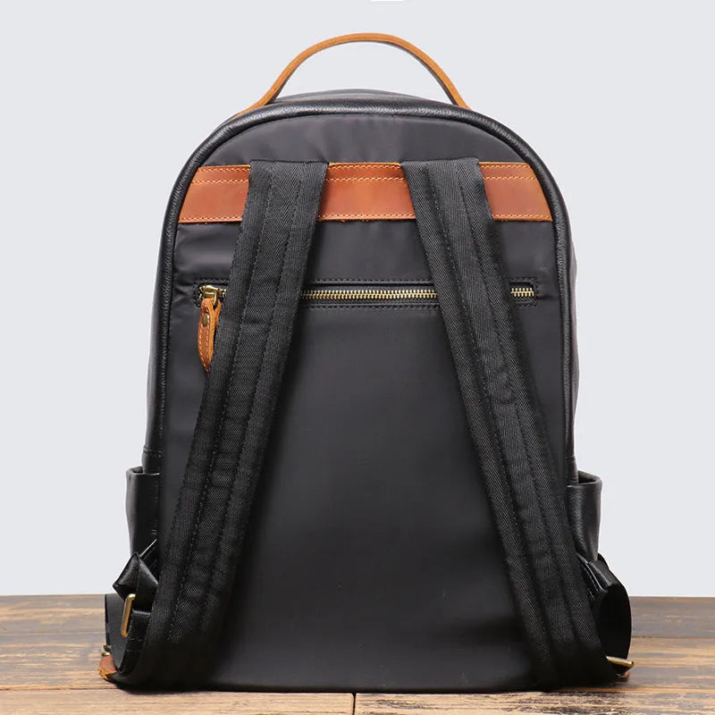 Black genuine leather top grain cowhide expandable travel backpack with curved shoulder strap