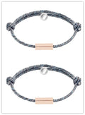 Pair of stainless steel magnetic bracelets for couples, silver and rose gold finish, with adjustable hand rope