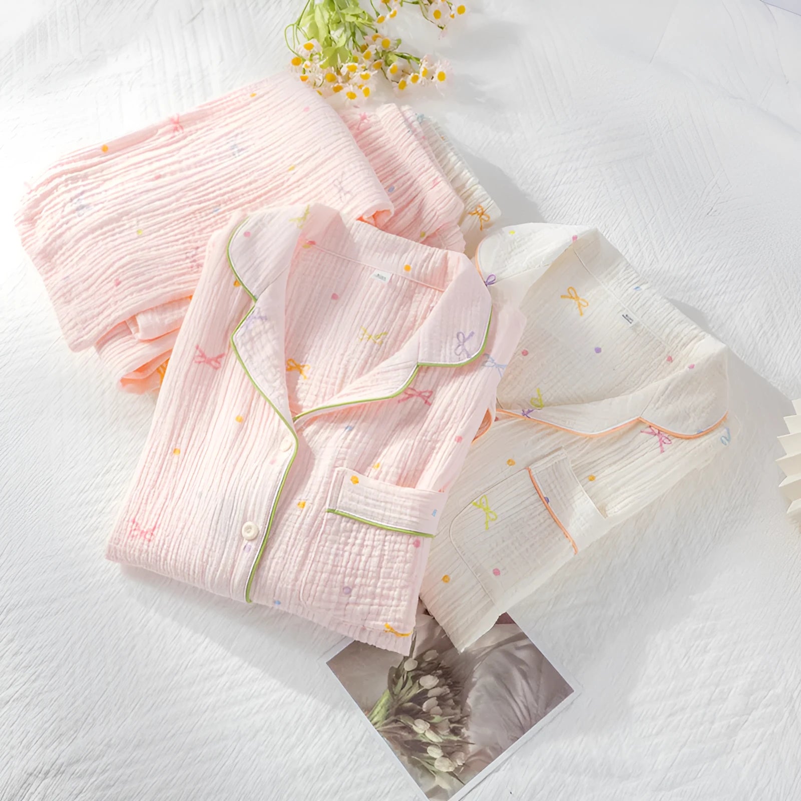 Women's long sleeve cotton pyjama set in pink, featuring a casual top and trousers.