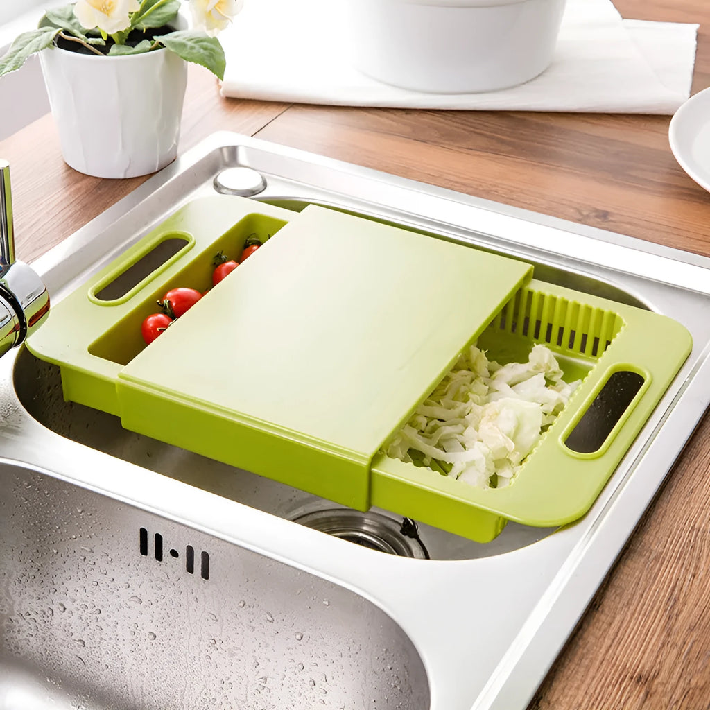 3-in-1 multi-purpose cutting board with colander in blue, showing integrated drainer and ergonomic handles