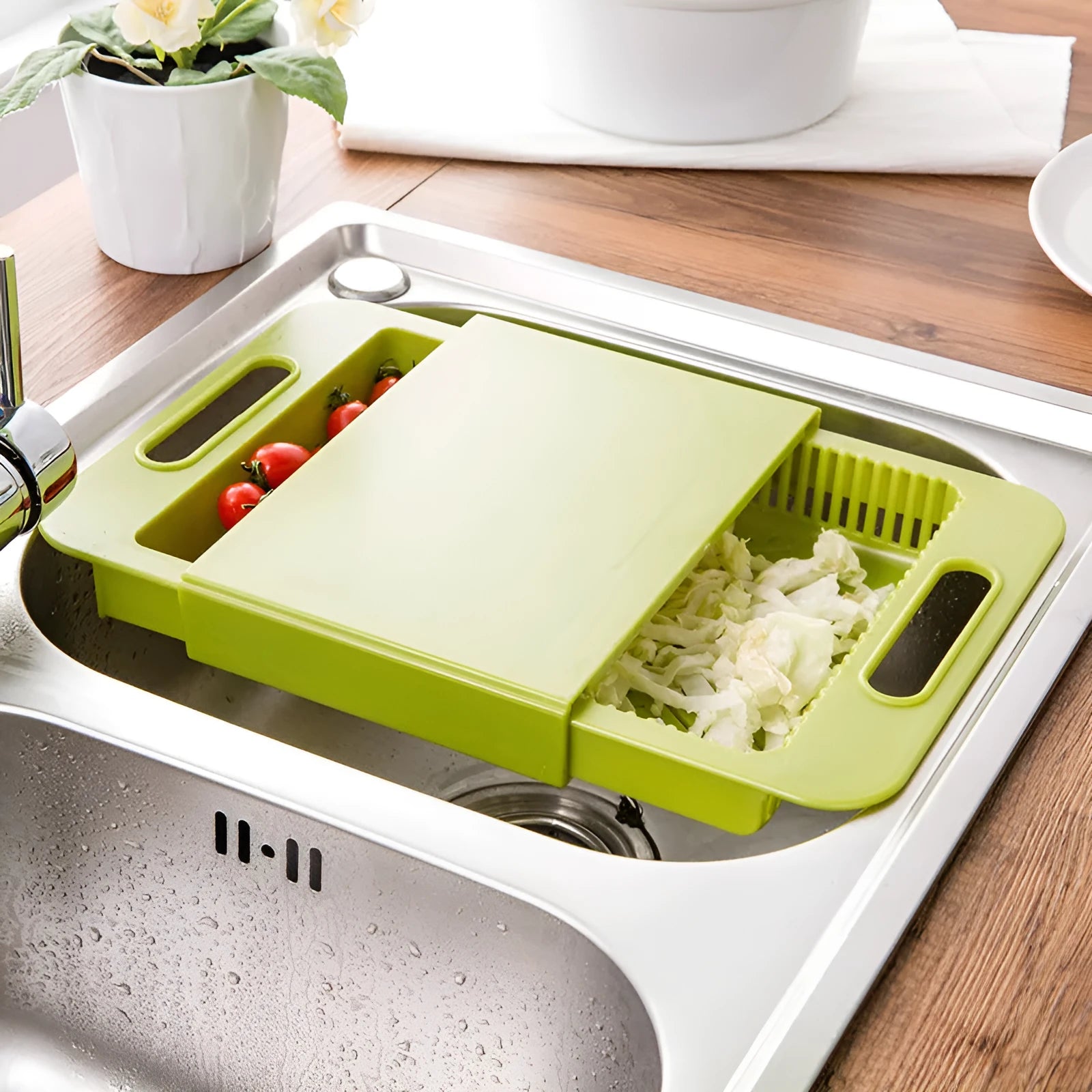 3-in-1 multi-purpose cutting board with colander in blue, showing integrated drainer and ergonomic handles