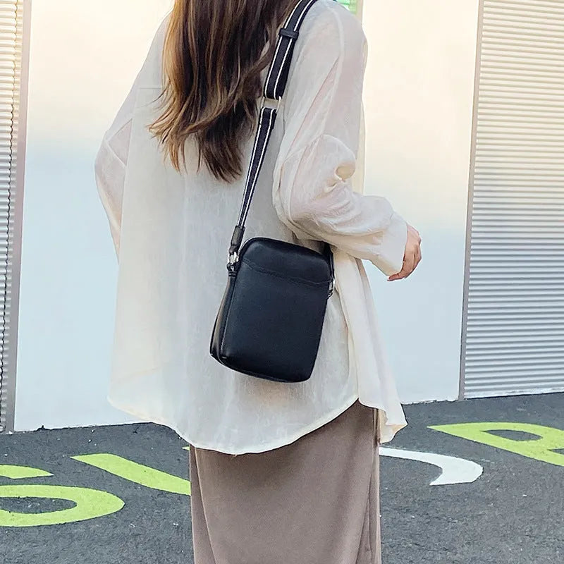 Solid colour PU leather crossbody phone bag for women in beige, showing front view.