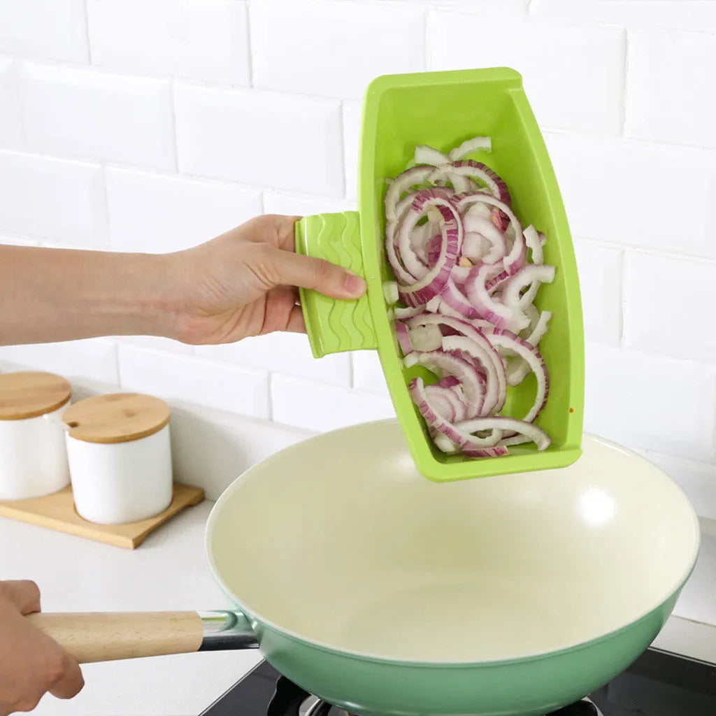 Green multi-function cutting board with drainage holes mounted on a kitchen sink