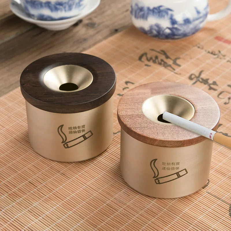 Retro brass ashtray with wooden lid in copper construction for living room use