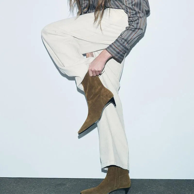 Women's brown square toe ankle boots with a side zip and a stiletto kitten heel on a white background.