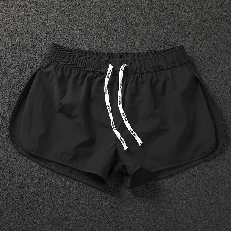Men's loose beach shorts in orange, fluorescent green and black colours with elastic waistband