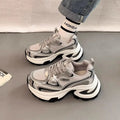 Women's silver and red mesh platform sneakers with a rubber sole and lace-up design