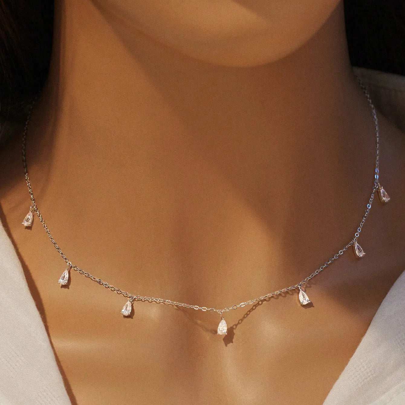 Gentle drop-shaped artificial zircon pendant on an adjustable 925 sterling silver O-chain necklace.