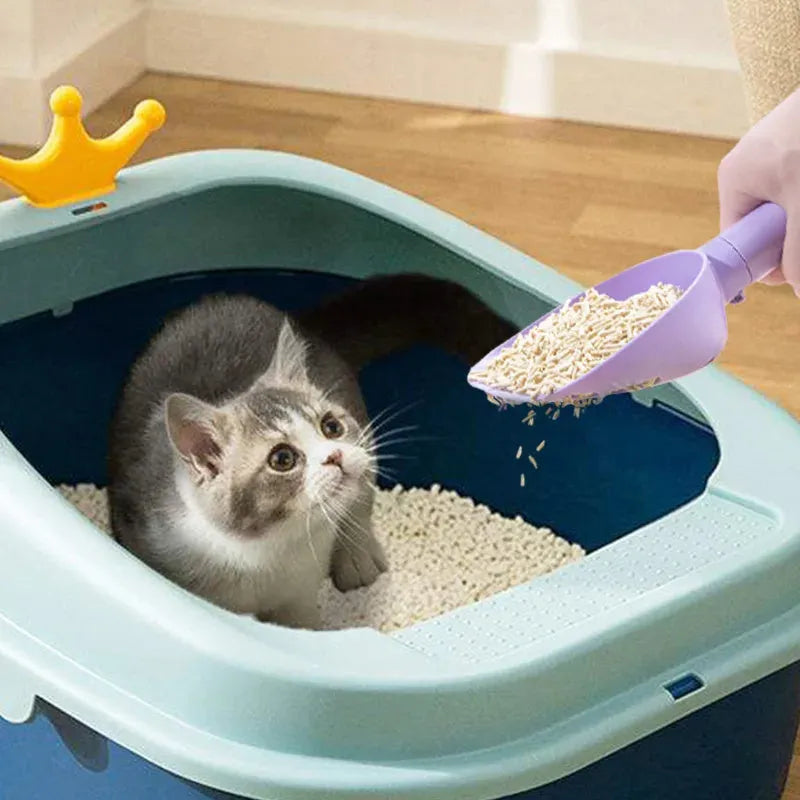 ABS plastic cat litter scoop with base featuring hidden bag storage and wall mounting capability
