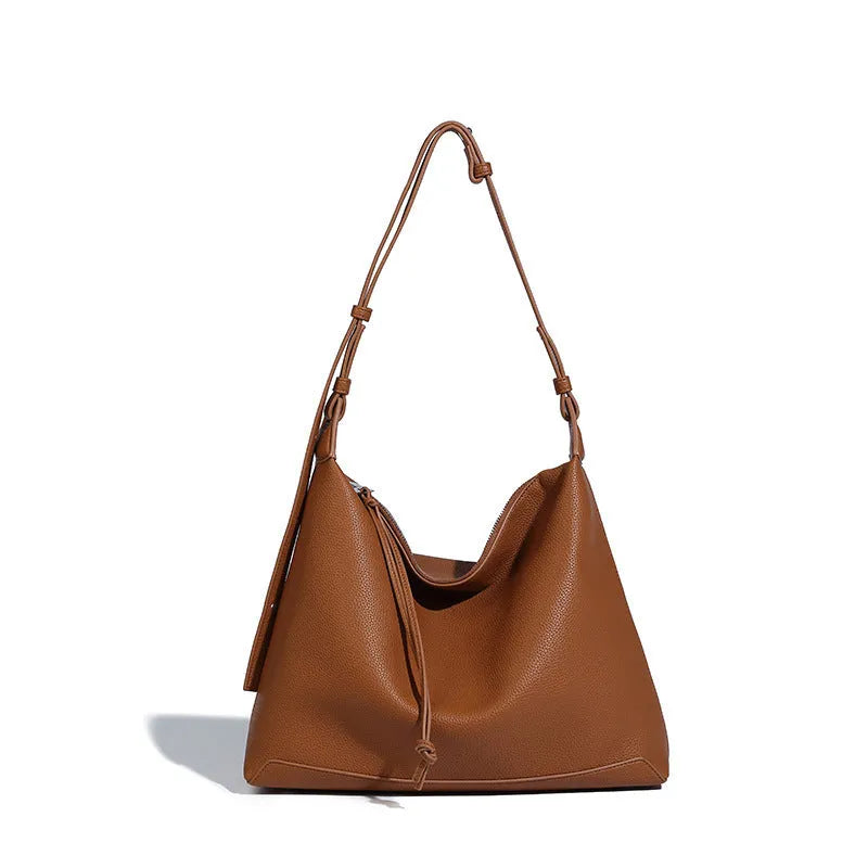 Large caramel coloured PU messenger bag with shoulder strap showing 36cm length