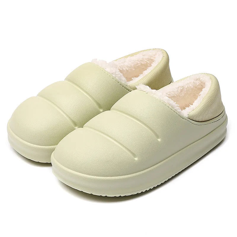 Green waterproof EVA cotton slipper with plush lining, flat sole, and hollow slip-on design.