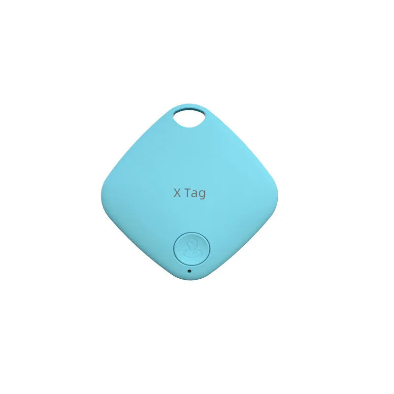 Small black Bluetooth key finder tracker on a keyring next to a smartphone showing location app.